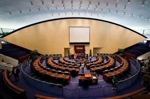 Interior of Toronto City Hall. Filled with seats around a semi-circle